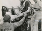 1944-21-10 Wounded pilot helped out of plane1