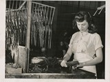 1947-10-01 Helen Gogich assembles toy planes1