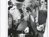 1966-17-08 John Lennon escorted by policeman1